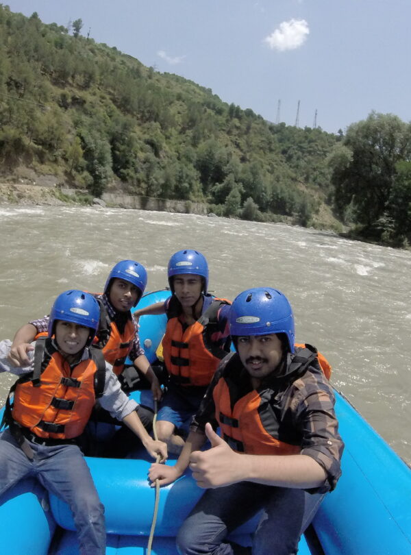 Tourists rafting on the Beas River in Kullu, Himachal Pradesh