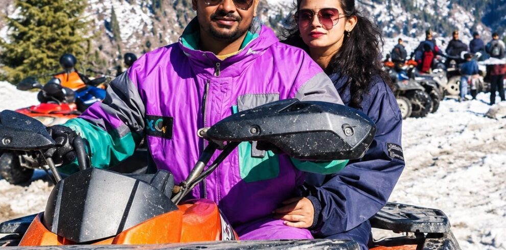 ATV ride in Himachal Pradesh with snow-covered Himalayan mountains
